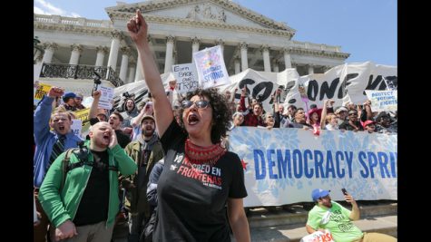 Alejandra Pablos of Arizona leads a chant as voting rights reform demonstrators stage a sit-in at the Capitol in Washington, Monday, April 11, 2016, urging lawmakers to take money out of the political process.  (AP Photo/J. Scott Applewhite)