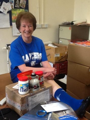 Ann Butler, librarian from Shropshire, England, shows off her care package from Mr. Cadorette.