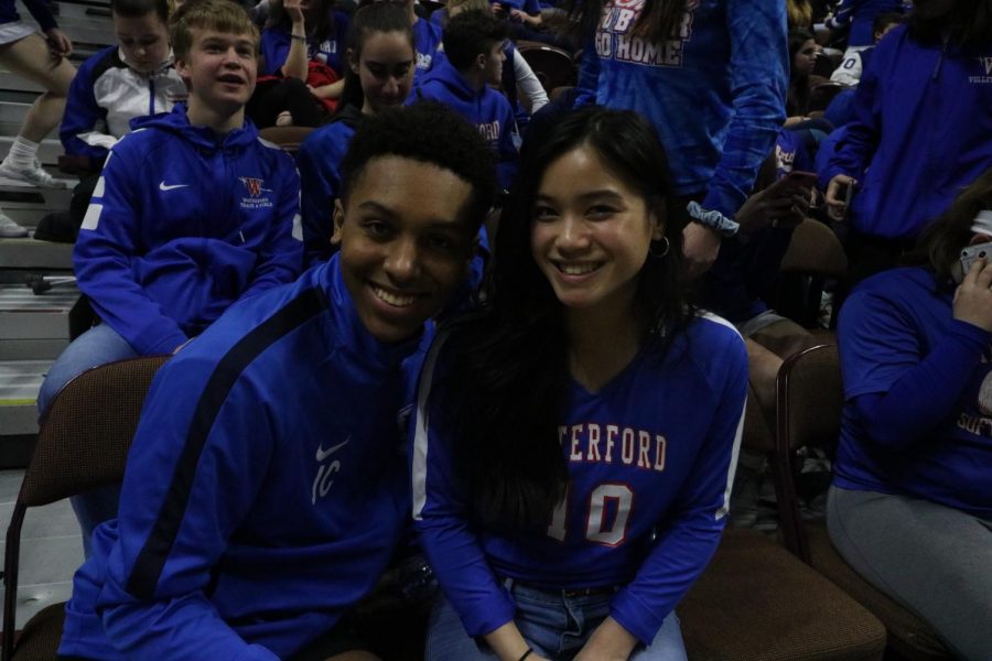 Jalen Chappelle and Jenny Keth cheering on the boy's basketball team at the ECC Championship game.