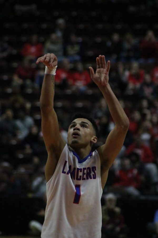 Senior, JJ Brennan, shoots the foul shot at the Division III State Championship game.