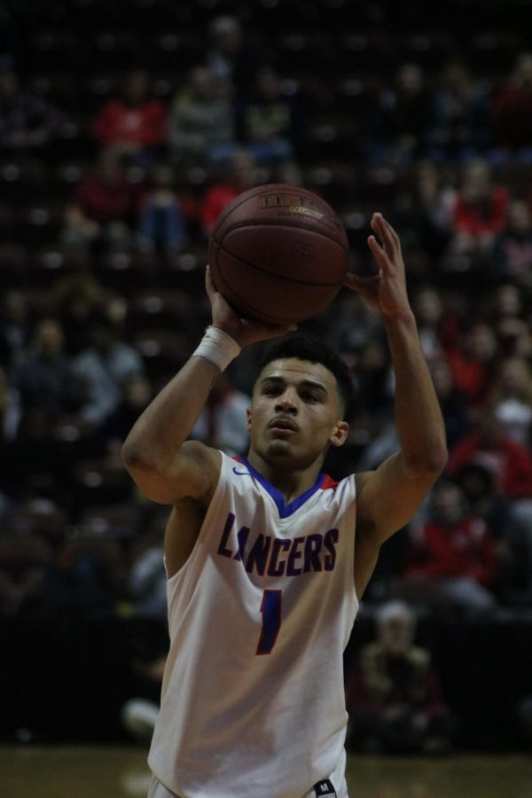 Senior, JJ Brennan, prepares to shoot his foul shot during the Division III State Championship game