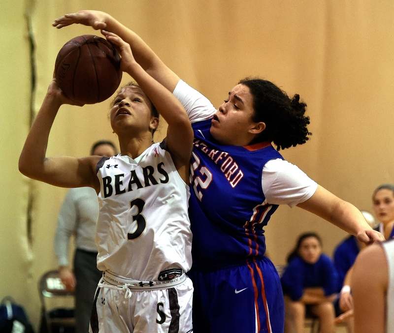 Marilyn Childs (right) blocks a shot against Stonington