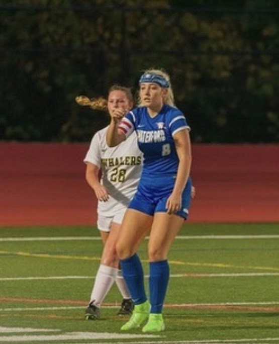 Kendra Gregg eyes the ball while battling the Whalers on Senior Night. The Lancers won 4-0 against the Whalers